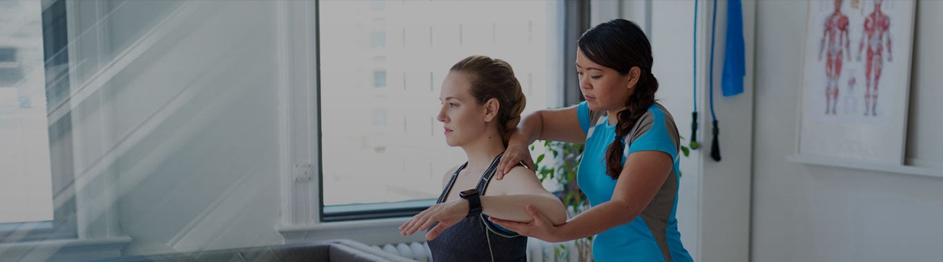 Physical Therapy Assistant providing therapy to her patient