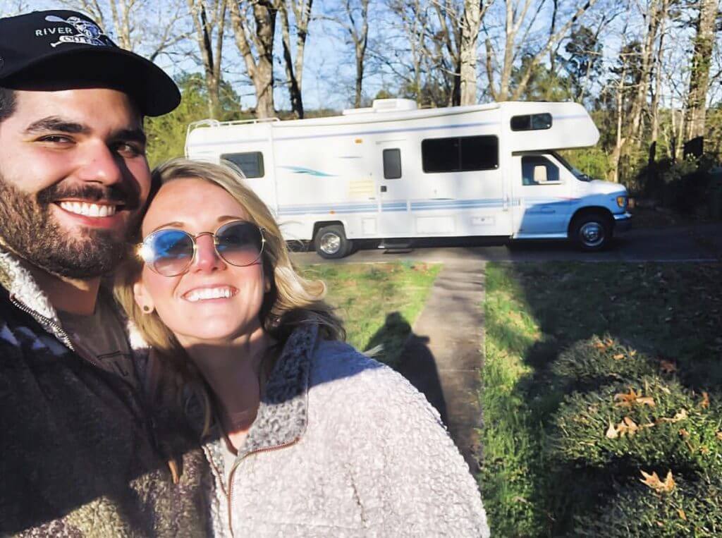 Physical Therapists Nick and Kayla in front of their RV