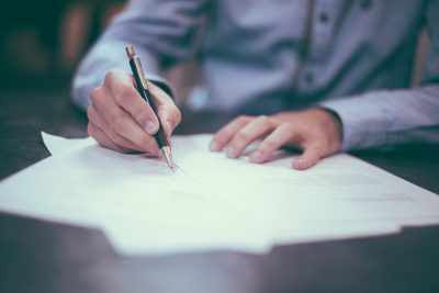 Man in dress shirt doing paperwork Man in dress shirt doing paperwork