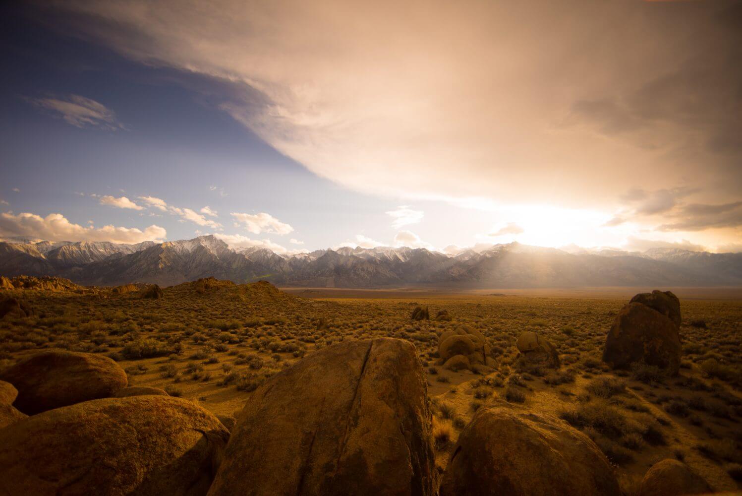 landscape of hills and sun streaming down landscape of hills and sun streaming down