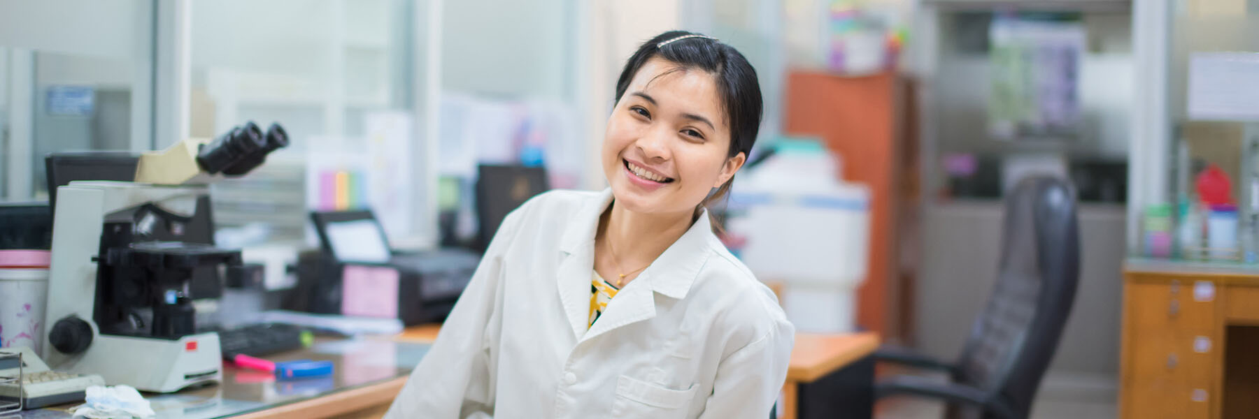 Medical technician working at desk