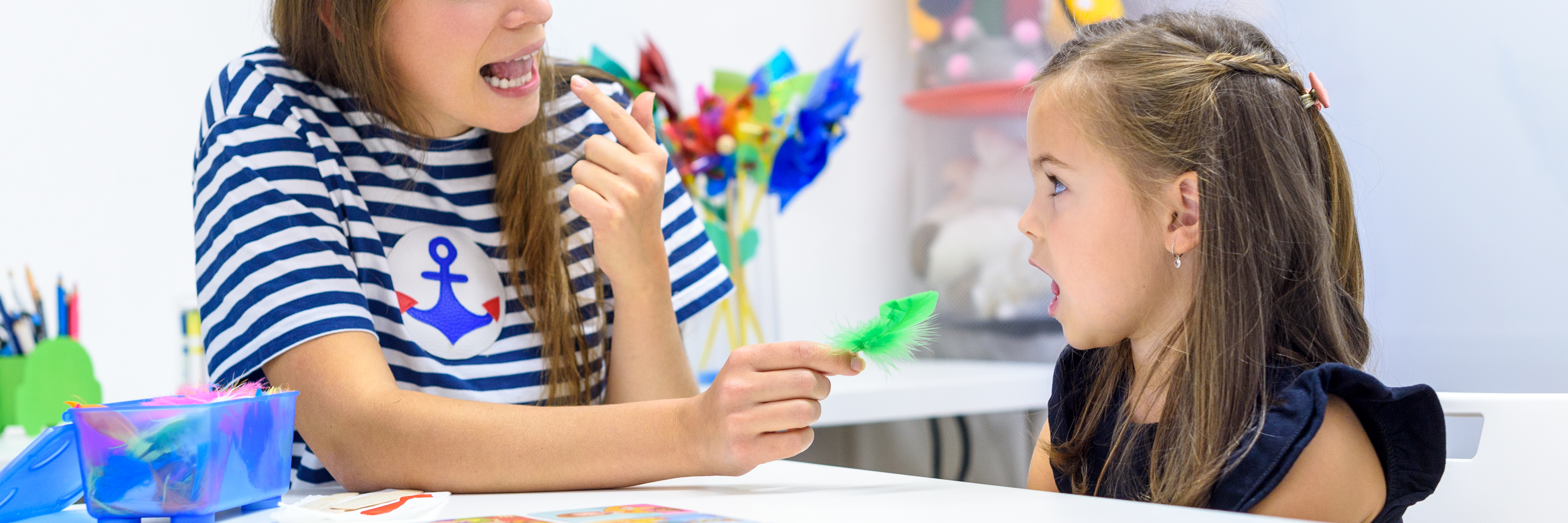 speech pathologist works with young boy on speech speech pathologist works with young boy on speech
