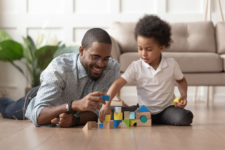 Dad and son playing with construction blocks Dad and son playing with construction blocks