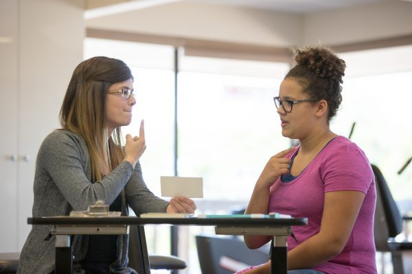 Speech Language Pathologist working with a patient Speech Language Pathologist working with a patient