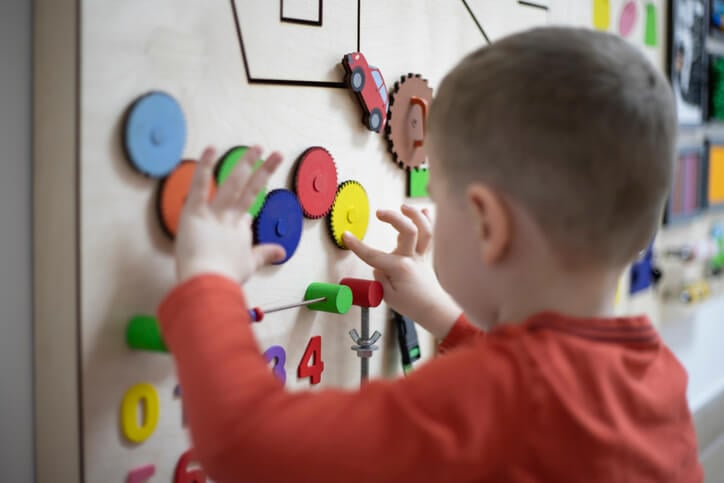 Boy playing with the interactive board Boy playing with the interactive board