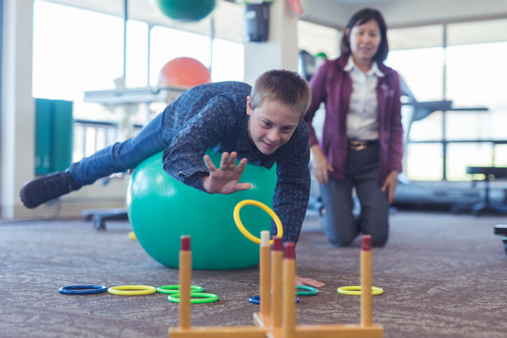 boy does workouts with an occupational therapist boy does workouts with an occupational therapist