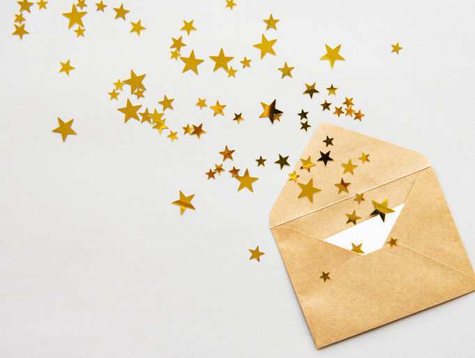 Envelope with confetti spilling out Envelope with confetti spilling out