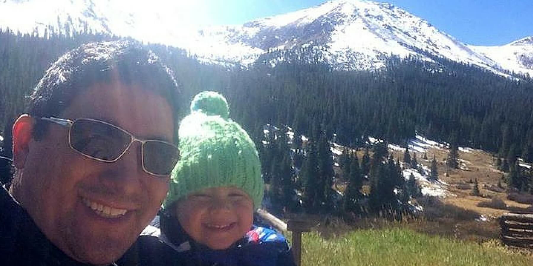 Allied traveler and his child in snowy mountains Allied traveler and his child in snowy mountains