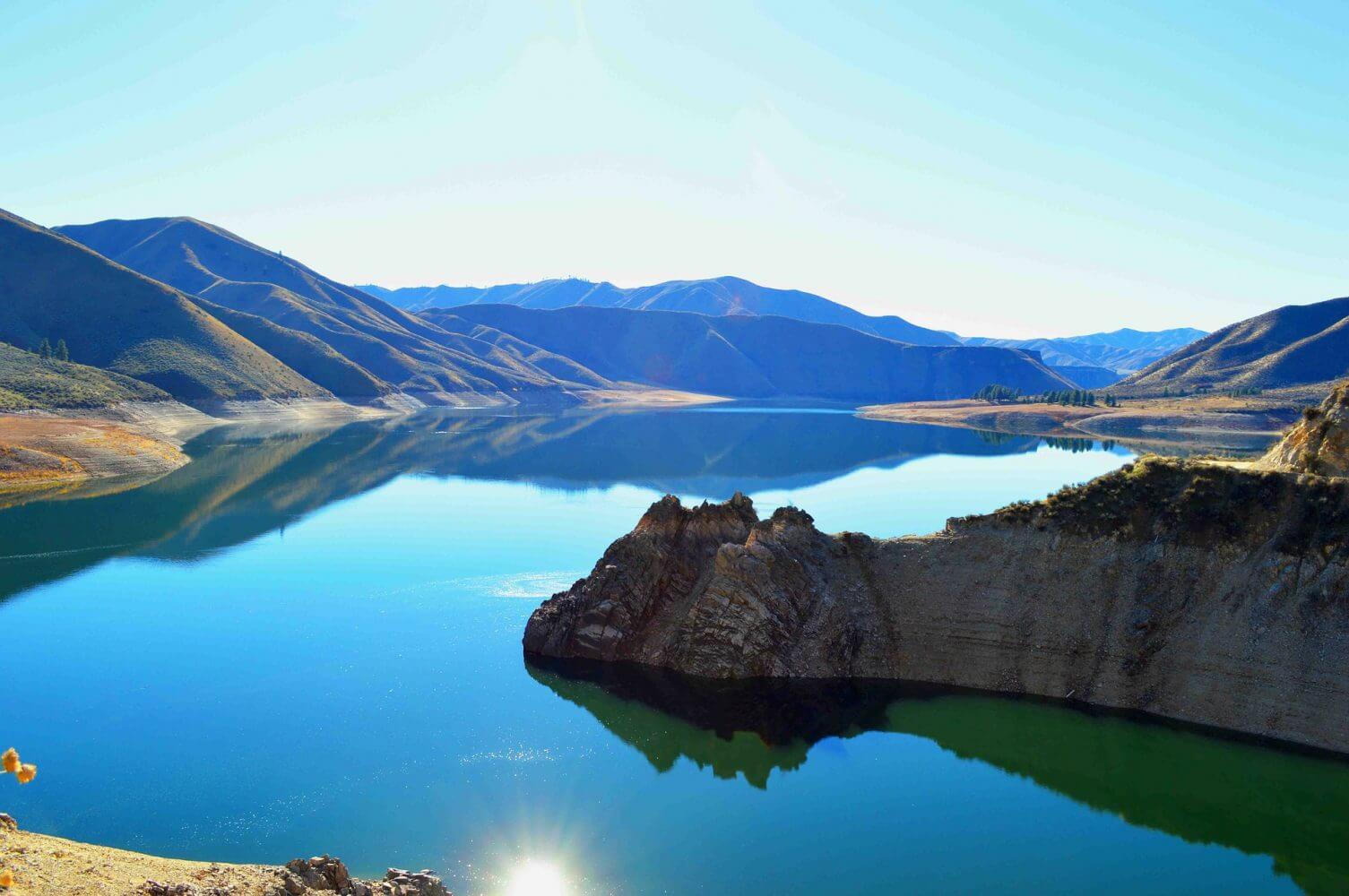 Idaho blue lake without people surrounded by mountains Idaho blue lake without people surrounded by mountains