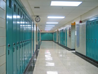 School hallway with lockers and no people School hallway with lockers and no people