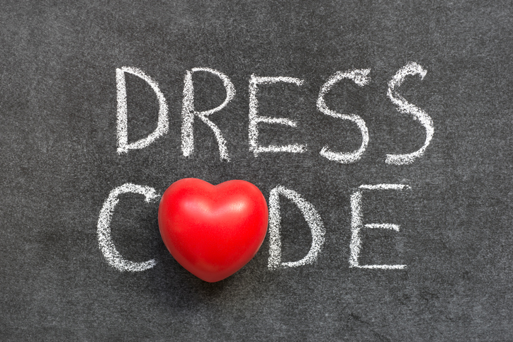 Dress Code words written in chalk with a heart shape for letter o Dress Code words written in chalk with a heart shape for letter o