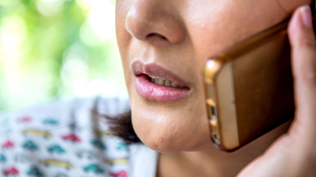 close up of woman's mouth talking on cellphone close up of woman's mouth talking on cellphone