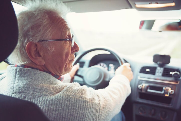 senior man driving a car senior man driving a car
