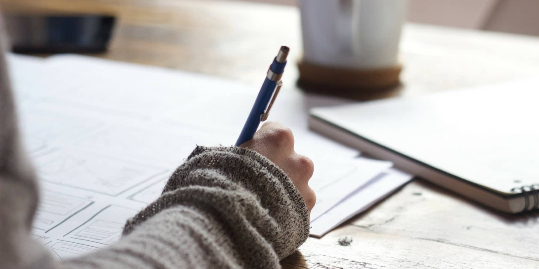 Women with pen doing paperwork or taxes Women with pen doing paperwork or taxes