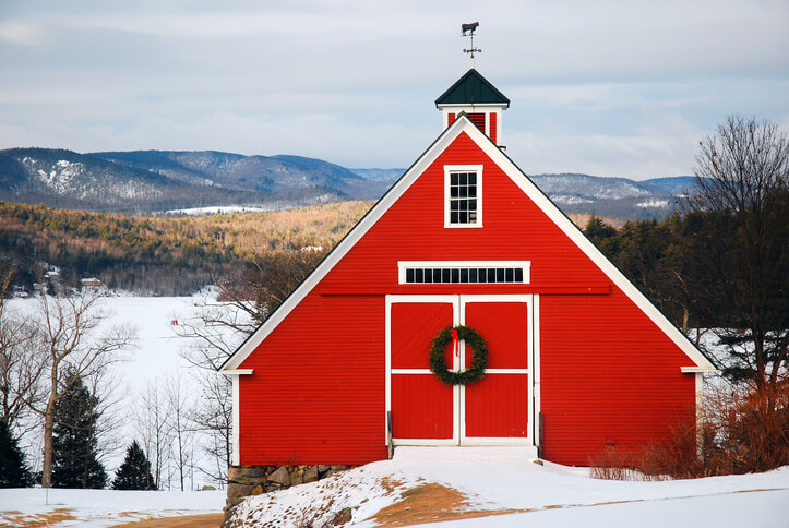 Red barn at Christmas with snow backdrop Red barn at Christmas with snow backdrop