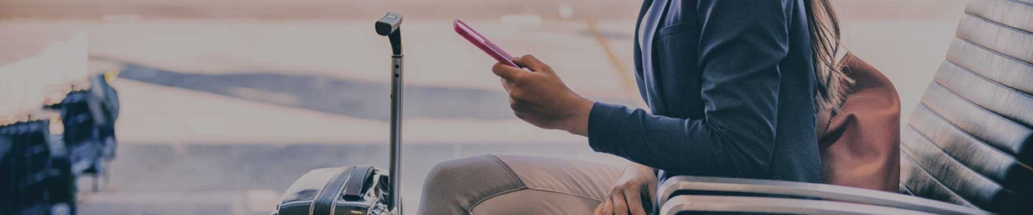 Woman in chair looking at phone