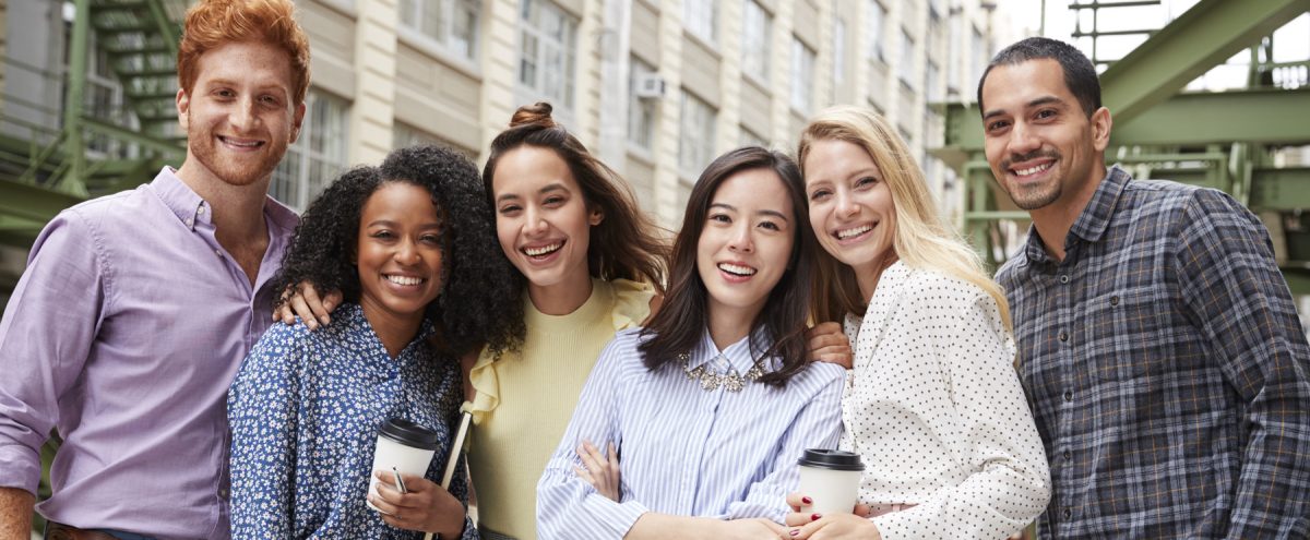 Two men and four women smiling together